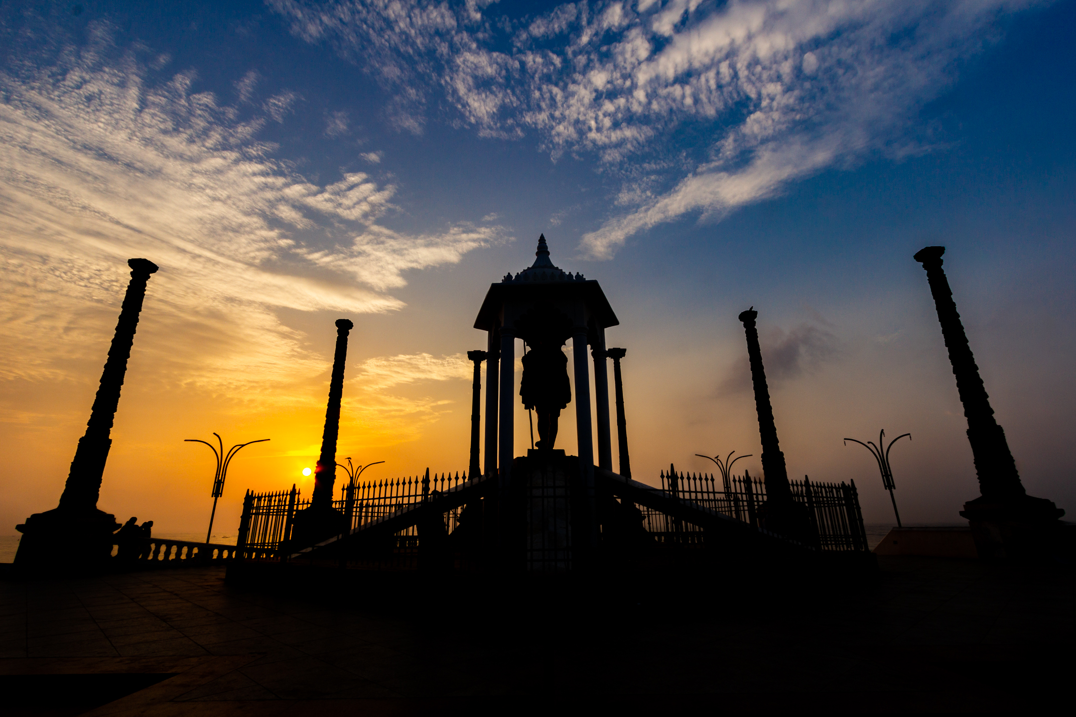 A monument silhouetted against the first light