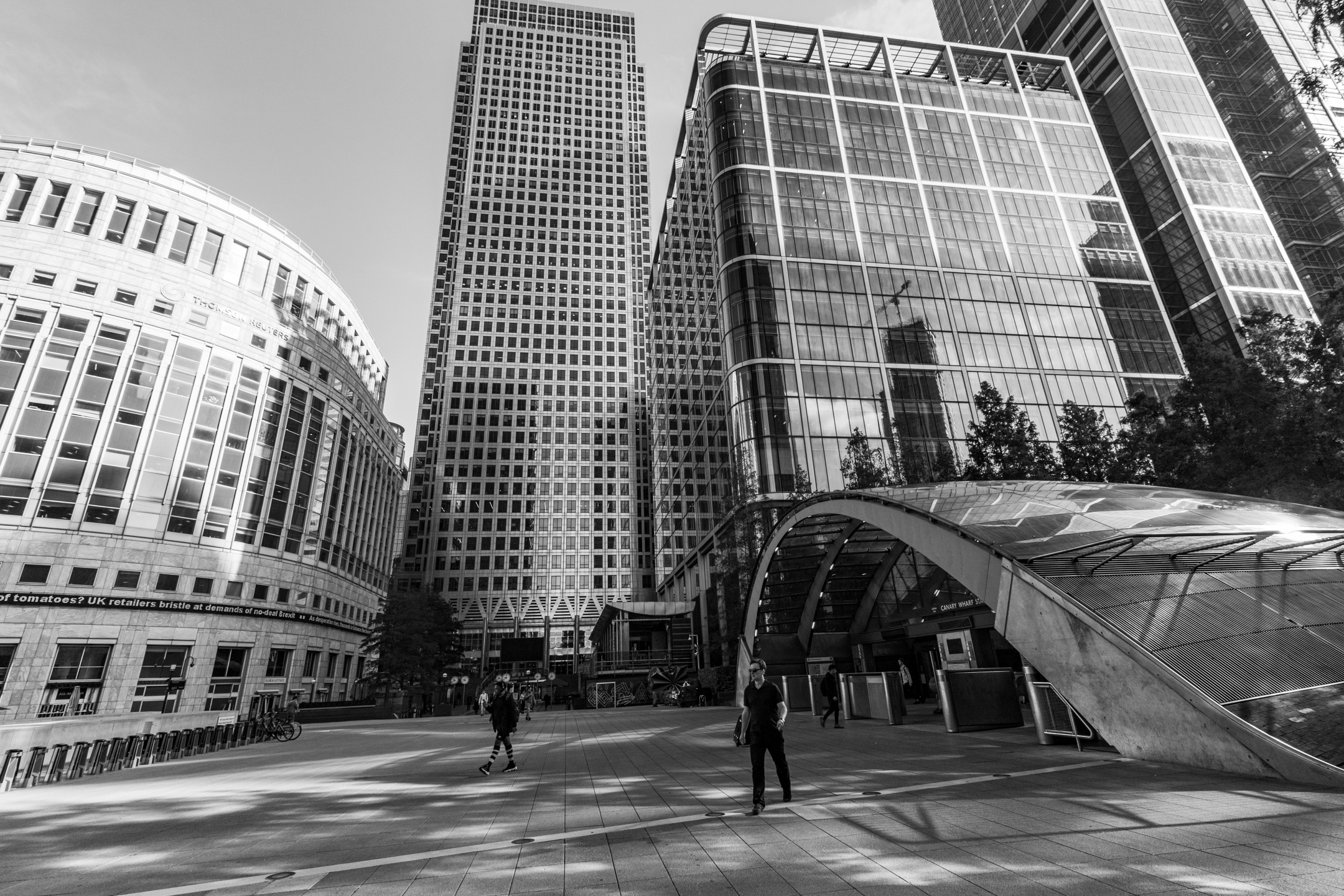 People moving through a busy urban architectural space
