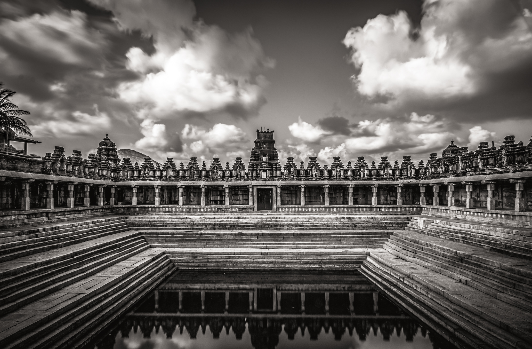 Black-and-white temple shapes and stepped water