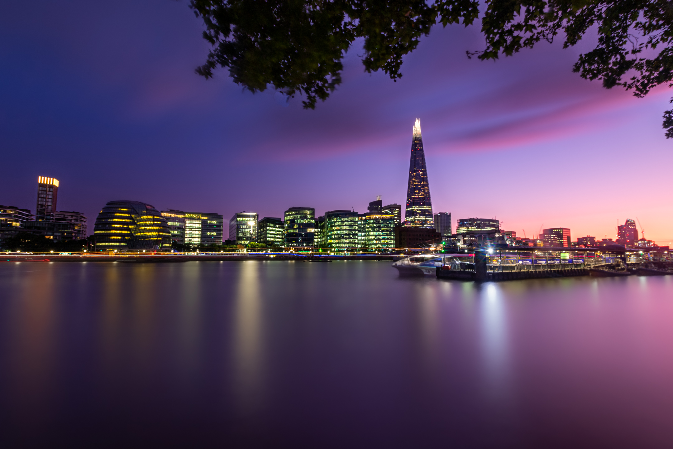London skyline at dusk with The Shard beside the River Thames