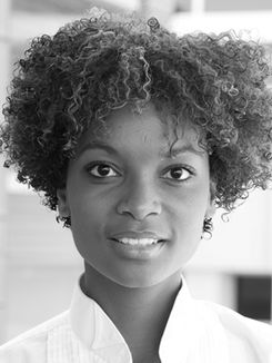 stock-photo-pretty-african-american-executive-standing-outside-with-pen-and-paper-99742673