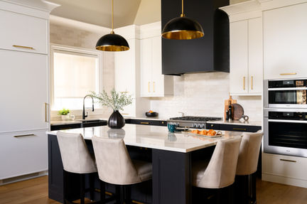 Refined dining space with a simple wood table, contemporary chairs, and understated decor.