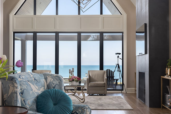 Lake House design, Modern window, custom upholstery in blue fabric in front of large window facing the lake, designed by Simply White Interiors in Niagara in the Lake