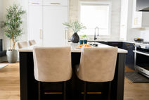 Refined dining space with a simple wood table, contemporary chairs, and understated decor.