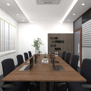 Modern conference room with long table and chairs.