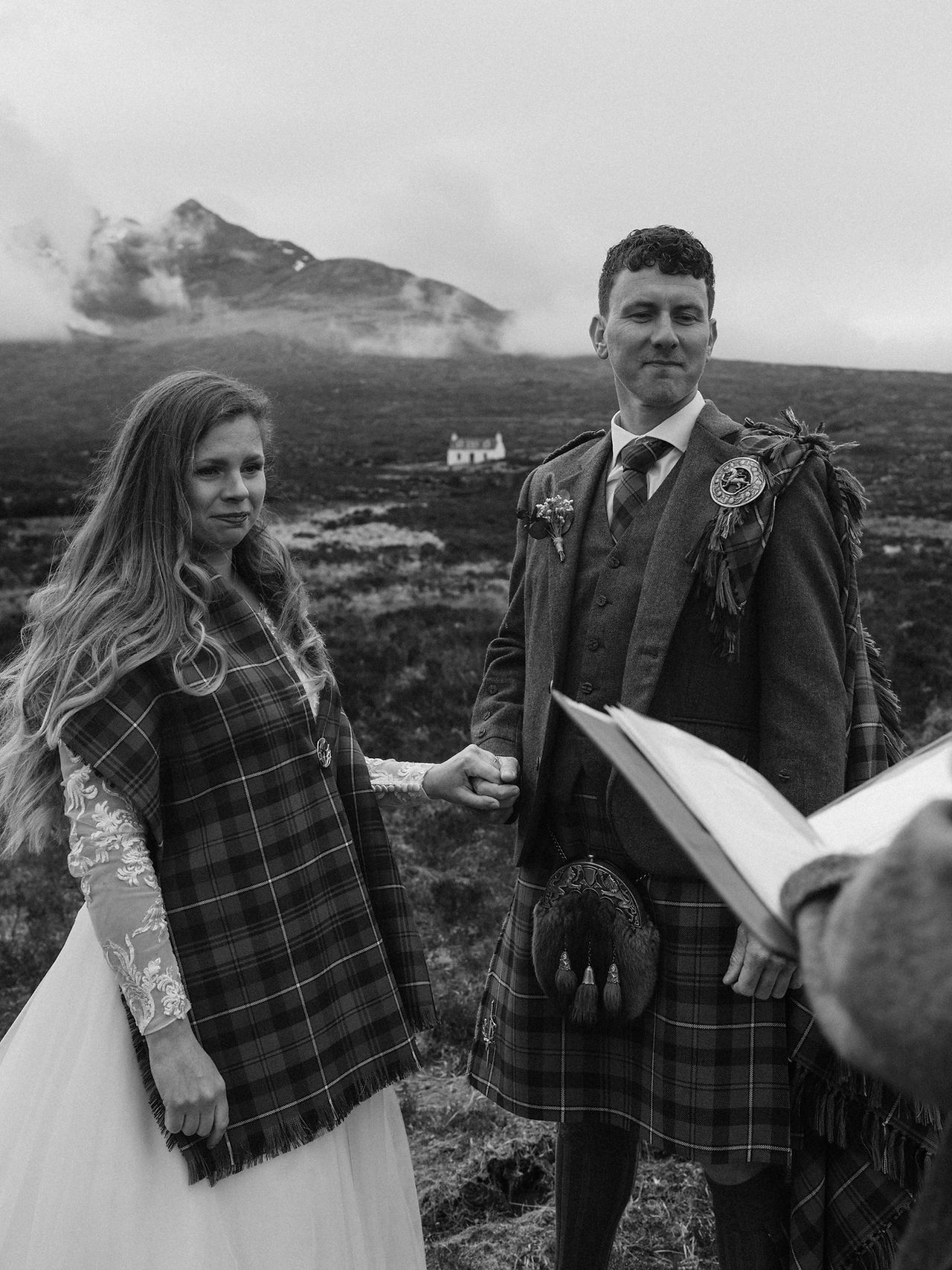 Bride and groom holding hands during Sligachan wedding ceremony