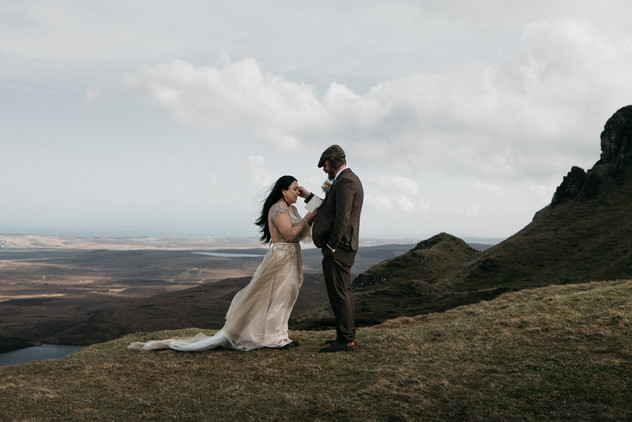Bride reading her vows to groom during Quiraing ceremony, Isle of Skye