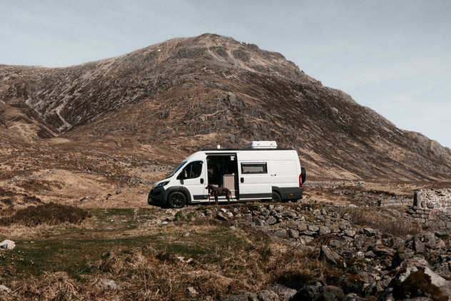 Couple's camper van parked beside the road through Glen Etive