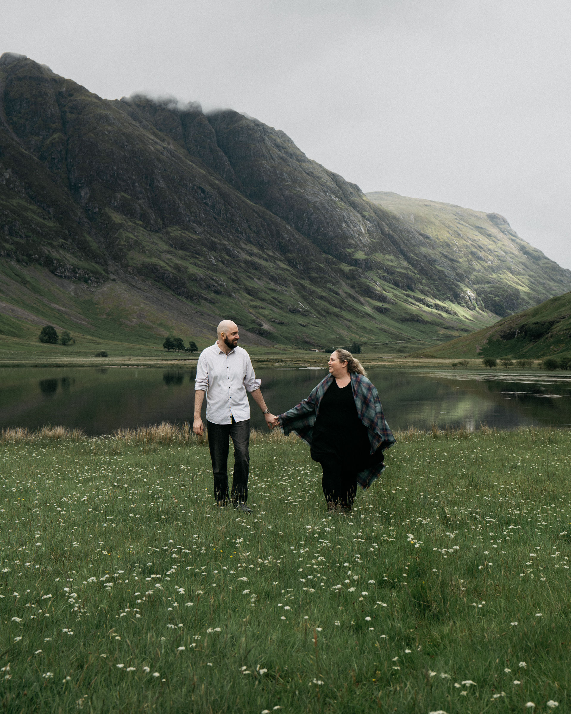 Couple exploring the Scottish Highlands together in Glencoe.