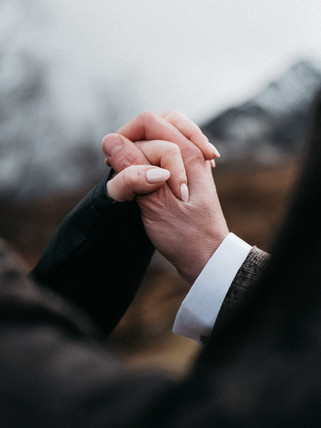 A delicate close-up of their hands as part of a story-led Highland session
