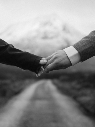 A delicate close-up of their hands as part of a story-led Highland session
