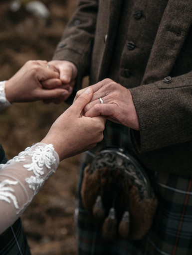 Bride and groom holding hands Isle of Skye