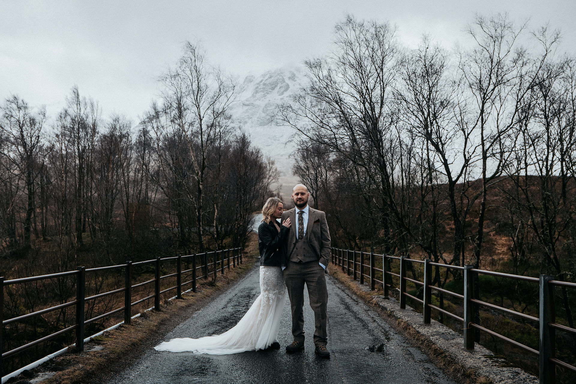 Powerful portrait with the couple standing before Glencoe’s peaks