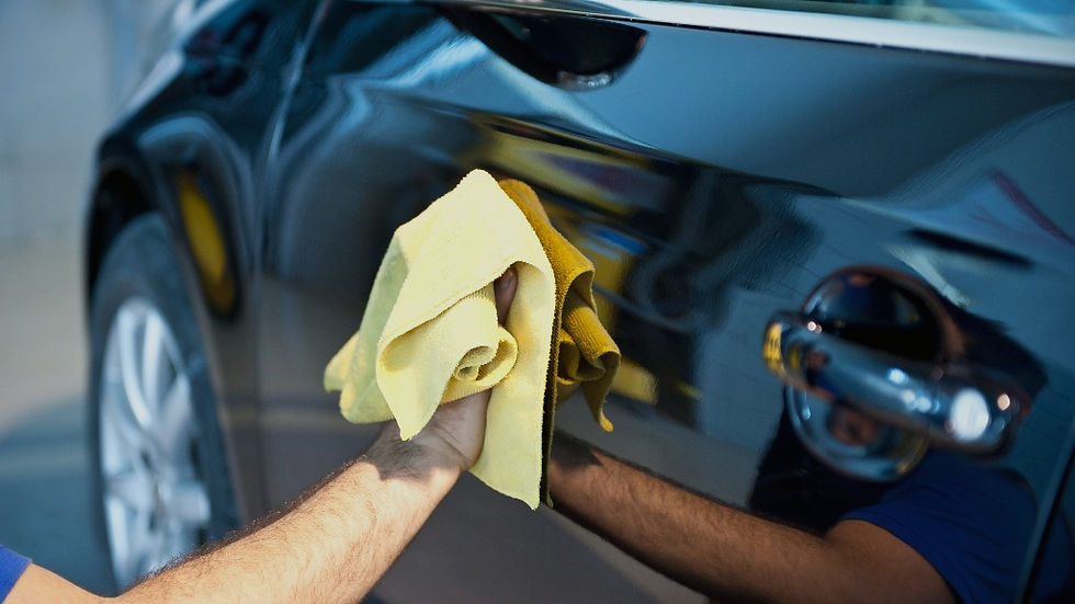 washing a fancy black new car with soap on a hot summer day_edited_edited_edited.jpg
