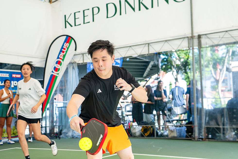 Kenneth Lee of Team 100PLUS tries his hands at pickleball. PHOTO: SPORTPLUS.SG / ALDRICH GOH