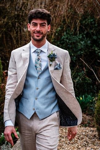 stone linen suit with blue pastel waistcoat