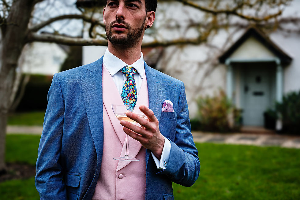 A man wearing a pink waistcoat