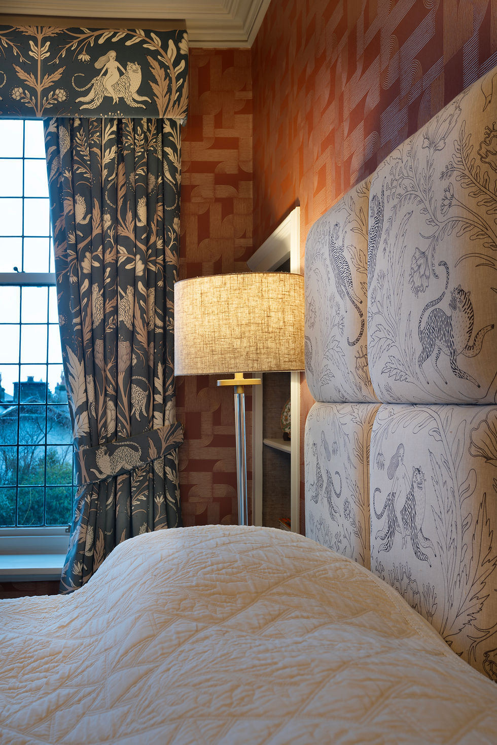 Thumbnail: Panthera linen upholstered headboard in a luxury contemporary bedroom with matching botanical curtains