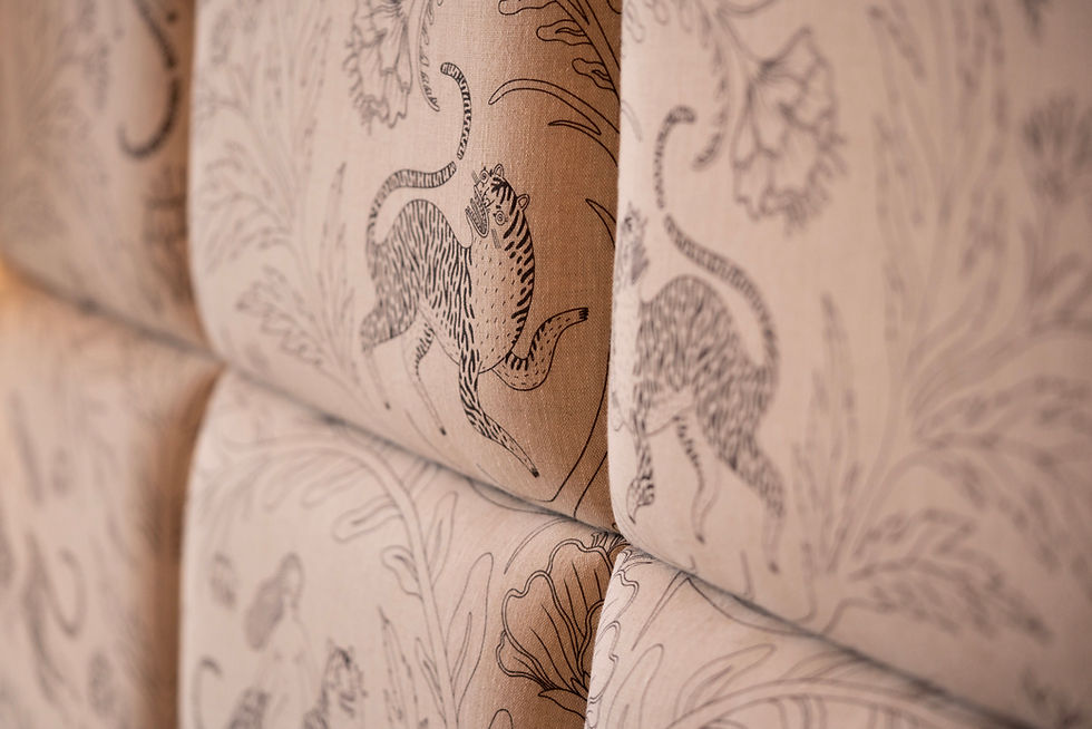 Thumbnail: upholstery detail in Panthera Champagne linen fabric with soft chalk tones and botanical design