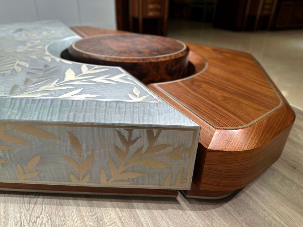 Thumbnail: Close-up detail of the Tora coffee table highlighting burl walnut grain and brushed nickel marquetry.