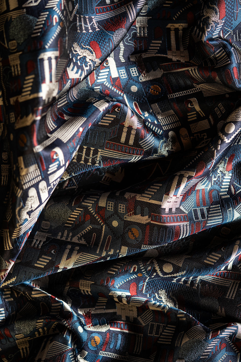Penrose Prowl Bauhaus silk jacquard draped in folds, showing woven architectural and animal motifs.