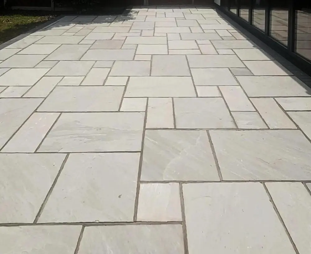 White stone patio with a patterned design