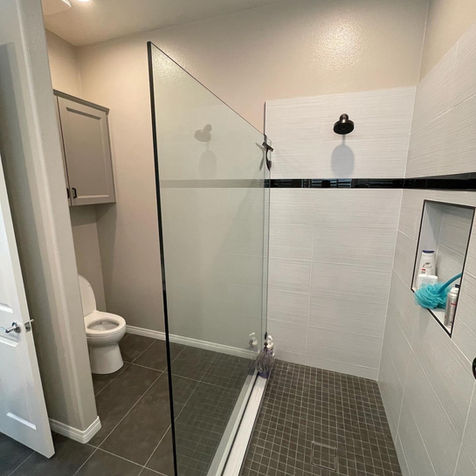 Beaumont CA bathroom remodel with modern walk-in shower and tile design by San Gorgonio Builders