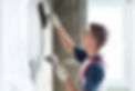 Thirty years old manual worker with wall