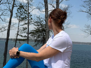 A woman looking at a lake