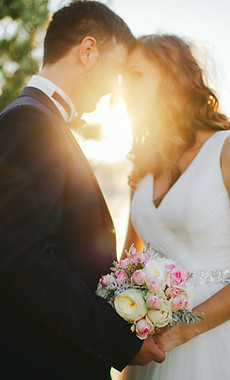 Newly wed couple at sunset