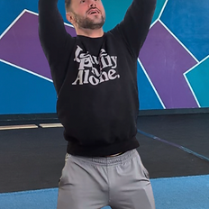 adult work out with baby being lifted into the air