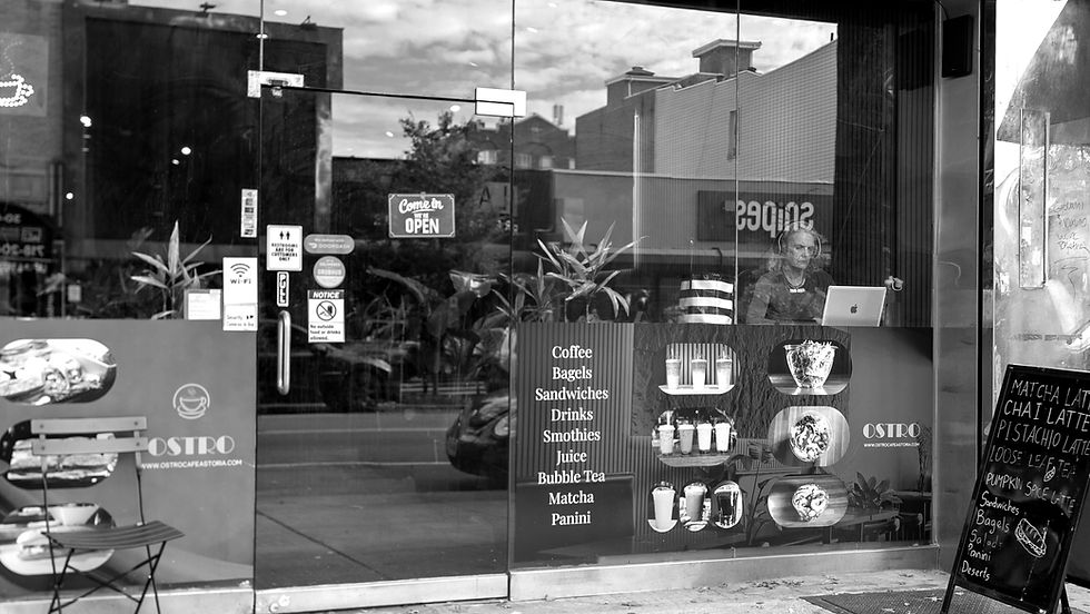 Eye-level view of a cozy cafe interior with wooden tables and coffee cups