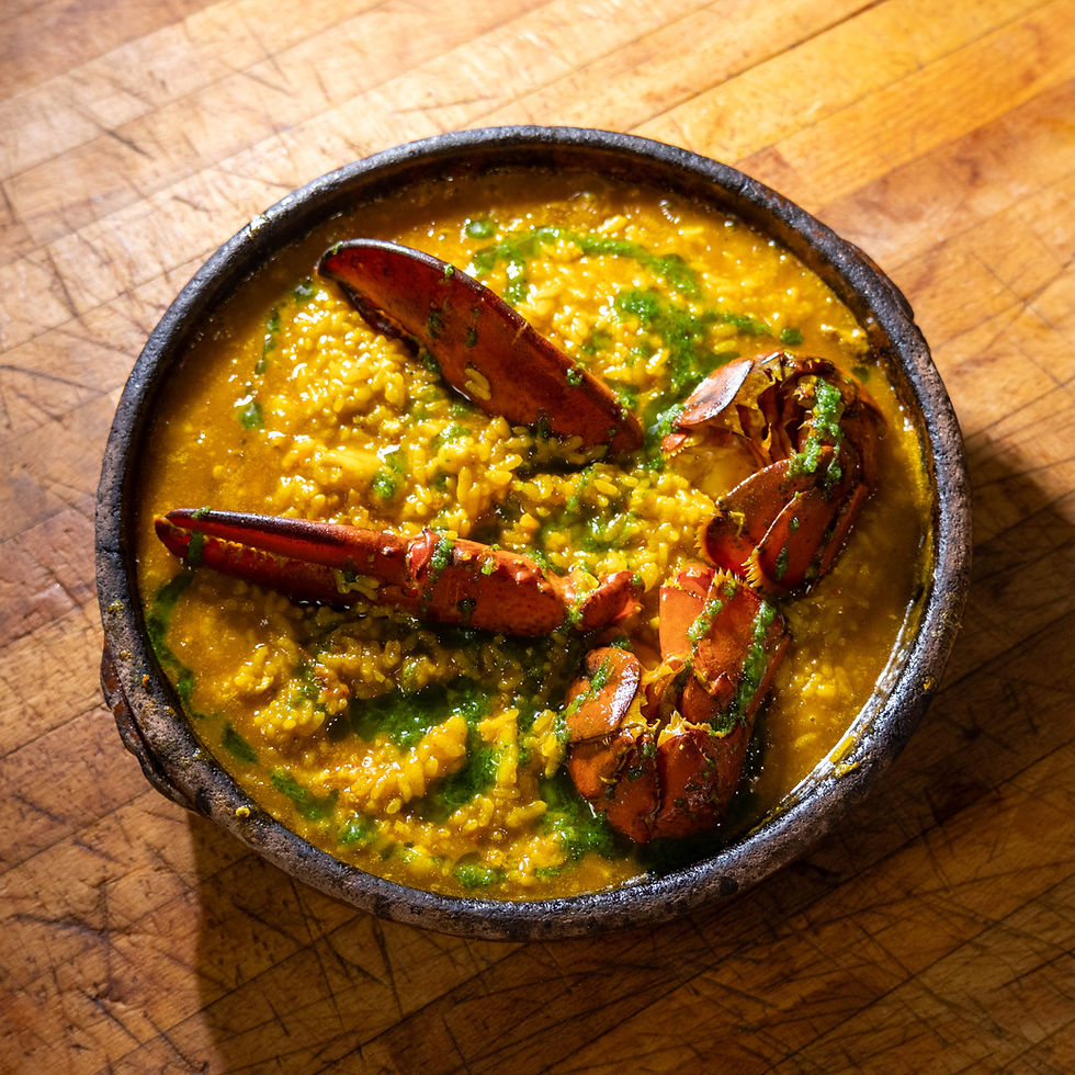 Traditional Galician arroz caldoso with lobster at Tomiño Spanish restaurant NYC