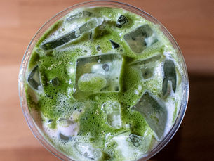 Matcha drinks at Ostro Café in Astoria including iced matcha, strawberry matcha, mango matcha, and behind-the-scenes preparation, showcasing one of the best matcha spots in Queens.