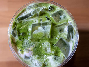 Matcha drinks at Ostro Café in Astoria including iced matcha, strawberry matcha, mango matcha, and behind-the-scenes preparation, showcasing one of the best matcha spots in Queens.