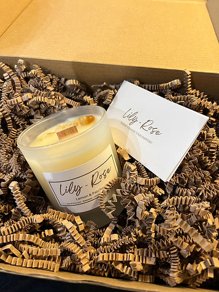 A non-toxic beeswax candle in gift packaging.
