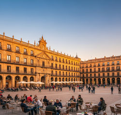 Plaza Mayor ( Plaza Mayor Salamanca glowing in golden light with historic arcades and vibrant cafés