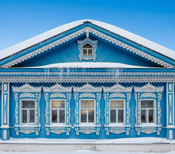 Irkutsk's Wooden Lace - Ornate traditional Siberian wooden house with intricate carved window frames