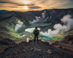 Hiker on Ridge with View of Mutnovsky Volcano Fumaroles