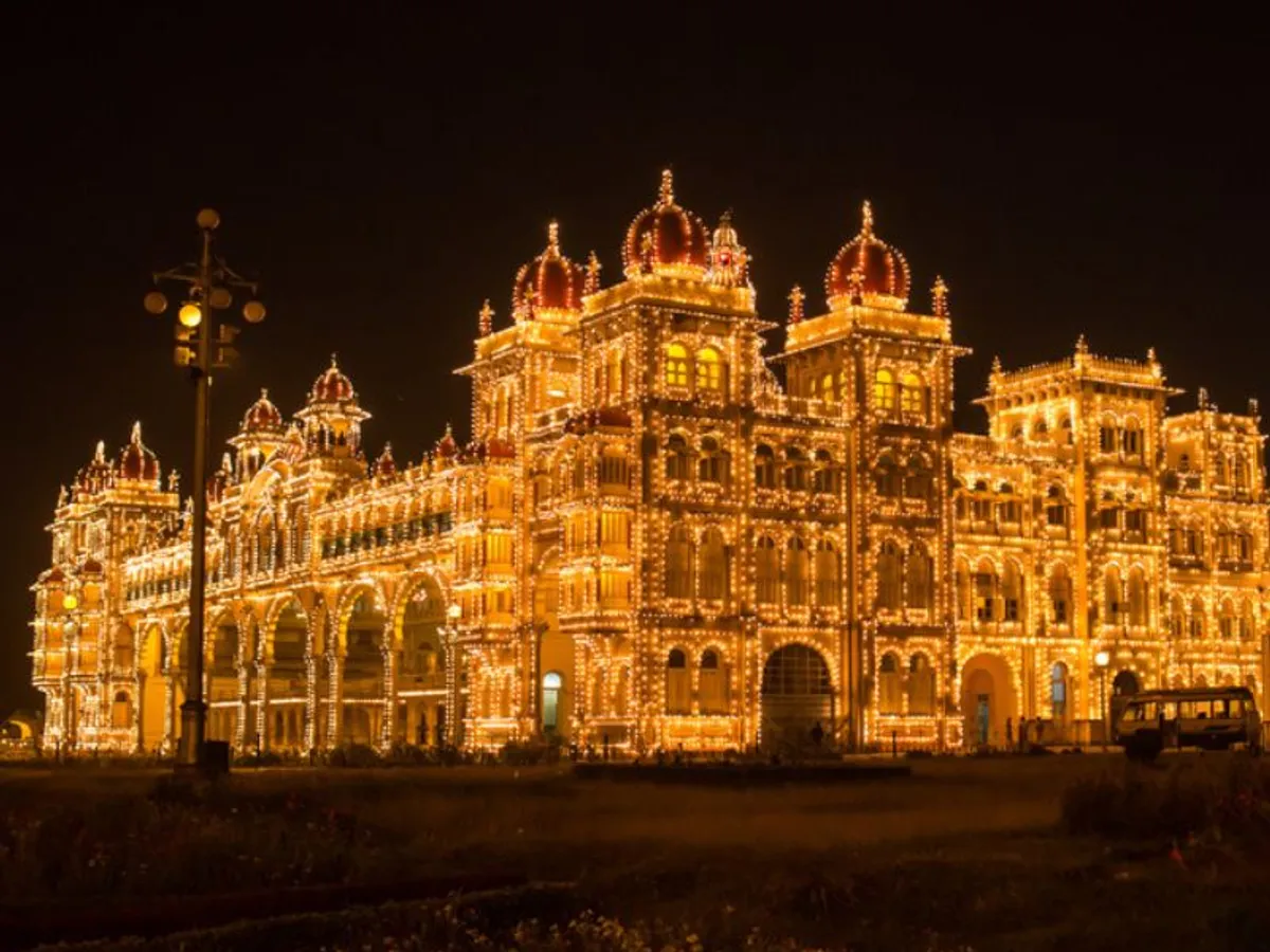 Mysore Palace, also known as Amba Vilas Palace, is the crown jewel of Mysore and a shining example of Indo-Saracenic architecture. Once the royal residence of the Wodeyar dynasty, this grand palace is a blend of Hindu, Muslim, Rajput, and Gothic styles—adorned with intricately carved domes, arches, and vibrant stained glass. Inside, the palace dazzles with ornate ceilings, mosaic floors, Belgian glass chandeliers, and a rich collection of royal paintings and artifacts. The Durbar Hall and Kalyana Mantapa (marriage hall) are highlights, showcasing the opulence of a bygone era. Every evening, the palace glows with over 90,000 lights, offering a breathtaking spectacle. It’s not just a monument—it's a walk through regal history. With Christone Holidays, explore the magnificence of Mysore Palace, where every hallway tells a story of royalty, heritage, and architectural brilliance in the heart of Karnataka.