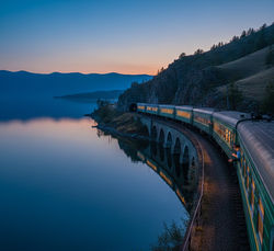 Trans-Siberian Rail Journey - Aerial view of Trans-Siberian train curving along Circum-Baikal Railwa