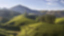 Munnar landscape – rolling hills covered with lush tea plantations and misty Western Ghats, Idukki district, Kerala