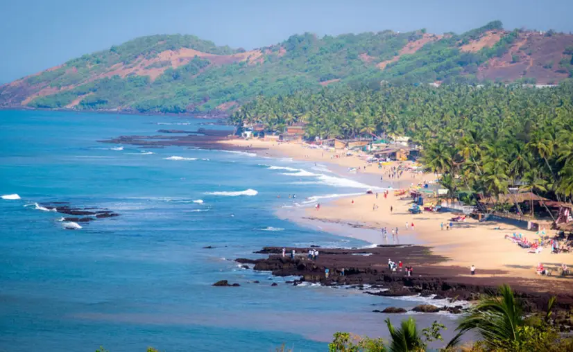Scenic view of Anjuna Beach in Goa, showcasing its rocky shoreline, golden sands, and vibrant beach culture under a bright tropical sky. The image captures the relaxed vibe of Anjuna, with palm trees swaying in the breeze, colorful beach shacks serving Goan cuisine, and tourists lounging or strolling along the coast. Famous for its unique blend of natural beauty and hippie spirit, Anjuna Beach is a must-visit destination for travelers seeking tranquility mixed with bohemian charm. The Arabian Sea sparkles in the background as waves crash gently against the rocks, creating a picturesque seaside escape. Known for its legendary Wednesday Flea Market, sunset parties, and music-filled nights, Anjuna Beach remains a hotspot in North Goa tourism. Christone Holidays includes Anjuna Beach in its Goa tour packages, offering travelers a chance to explore this iconic location, enjoy beachside leisure, and soak in the rich cultural and musical vibes that define the spirit of Anjuna.Scuba diving in