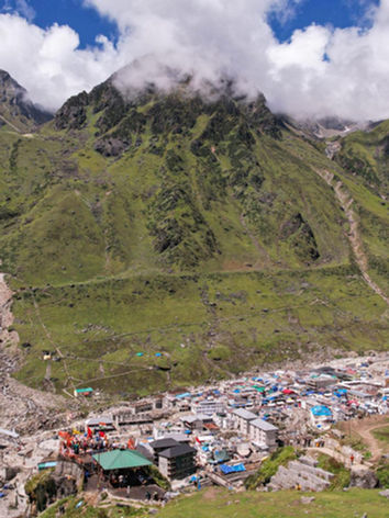 The Kedarnath Temple amidst the stunning Himalayan mountain range tour package with christone holidays