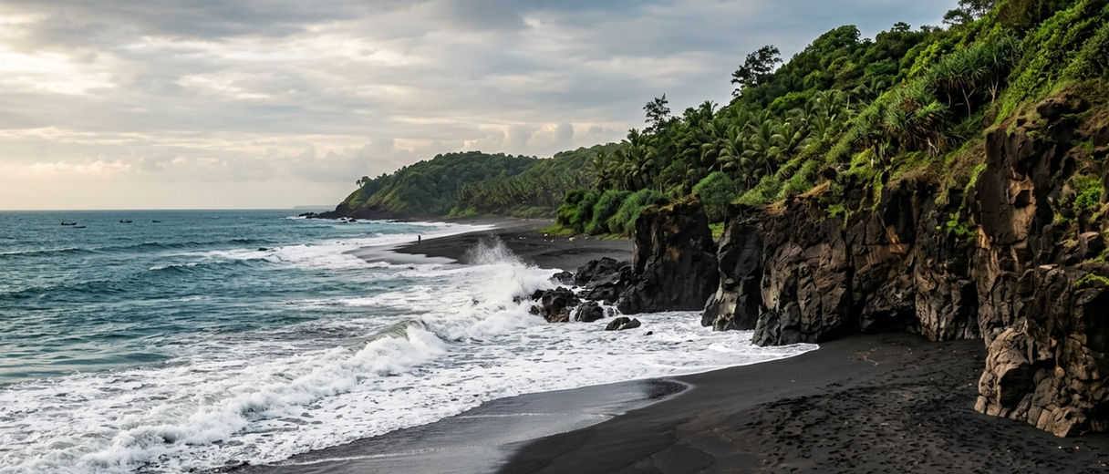 Tilmati Beach with black sand and rocky cliffs