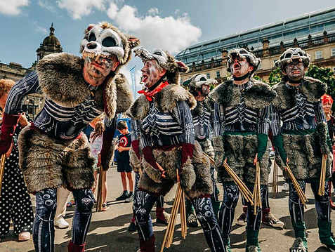 "Dogs of Doom" performers dressed as zombie dogs
