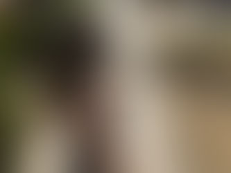 A girl sips an iced coffee