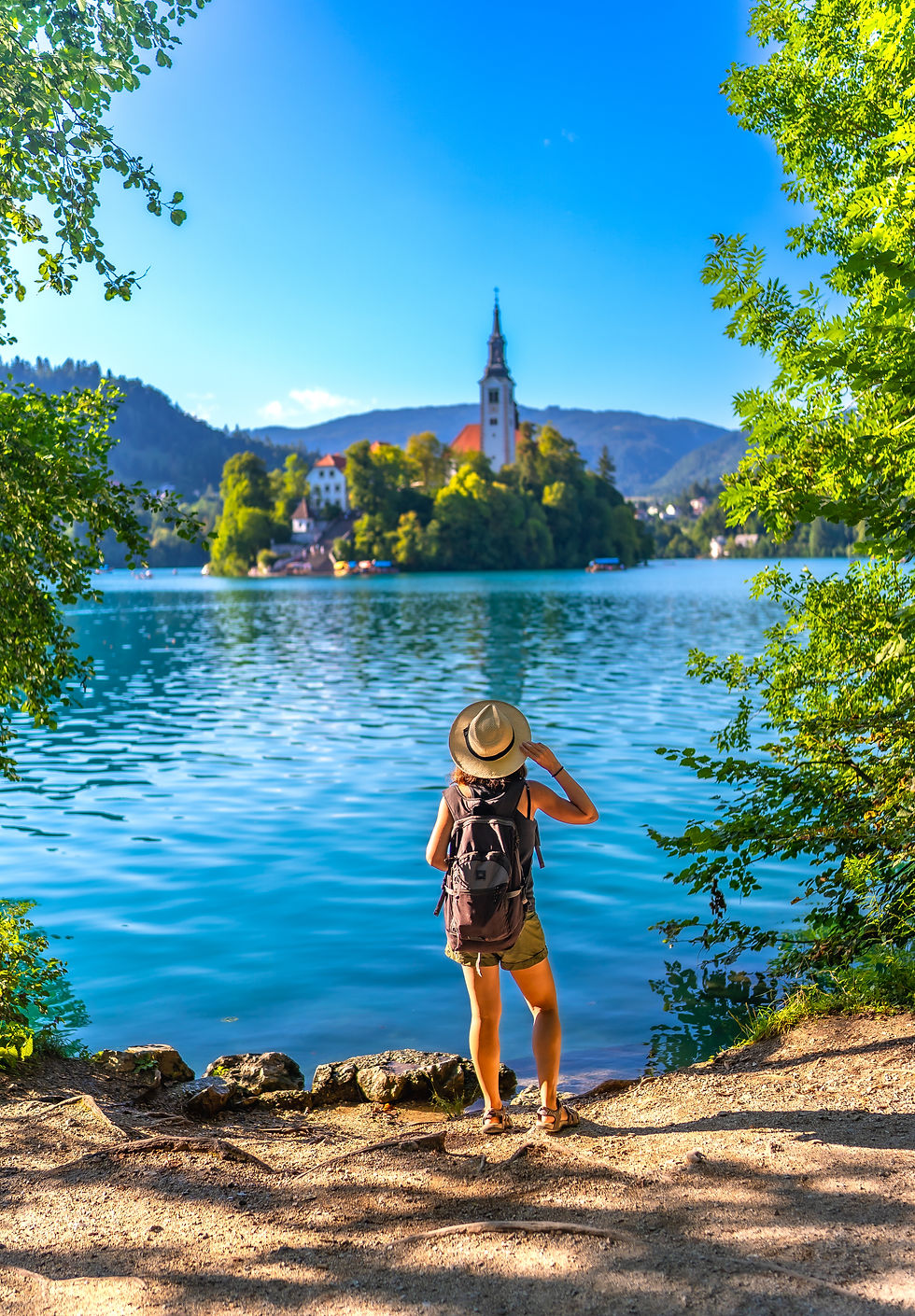 tourist-admiring-lake-bled-island-with-pilgrimage-2026-03-25-08-29-22-utc.jpg