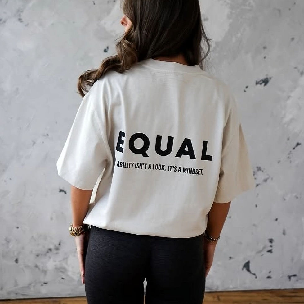 Woman seen from behind wearing a white Equal Clothing T-shirt.