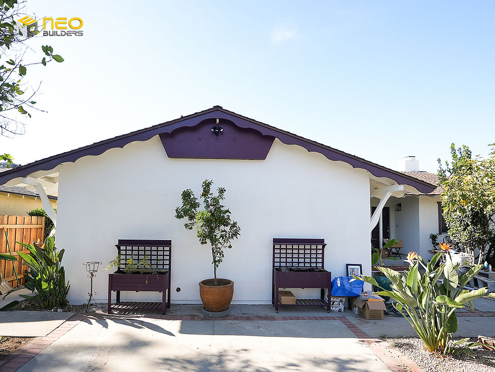 Finished exterior of a Northridge garage conversion ADU with purple mulberry trim and landscaped yard.